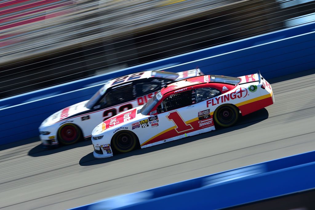 FONTANA, CA - MARCH 16: Michael Annett, driver of the #1 Pilot/Flying J Chevrolet, races Austin Cindric, driver of the #22 America's Tire/Discount Tire Ford, during the NASCAR Xfinity Series Production Alliance Group 300 at Auto Club Speedway on March 16, 2019 in Fontana, California. (Photo by Jared C. Tilton/Getty Images) | Getty Images