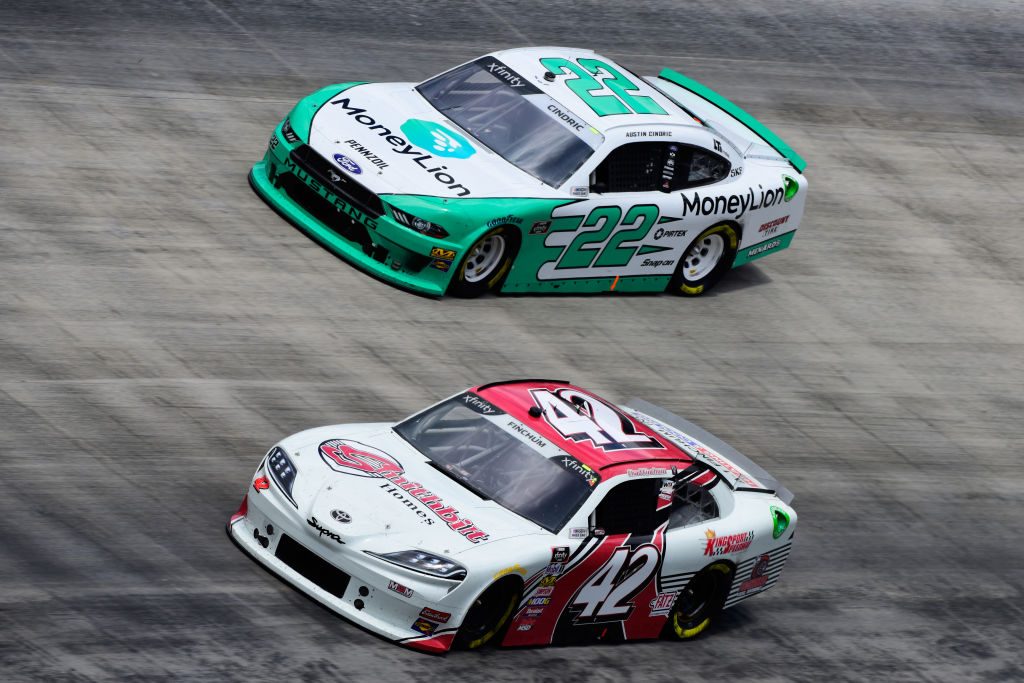 BRISTOL, TN - APRIL 06: Chad Finchum, driver of the #42 Amana Toyota, races Austin Cindric, driver of the #22 MoneyLion Ford, during the NASCAR Xfinity Series Alsco 300 at Bristol Motor Speedway on April 6, 2019 in Bristol, Tennessee. (Photo by Jared C. Tilton/Getty Images) | Getty Images