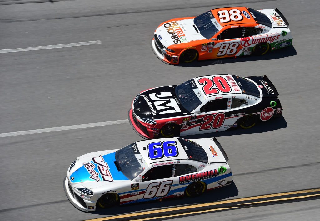 TALLADEGA, AL - APRIL 27: Timmy Hill, driver of the #66 VSI Racing/Overkill Motorsports Toyota, Christopher Bell, driver of the #20 Rheem/Johns Manville Toyota, and Chase Briscoe, driver of the #98 Nutri Chomps/Runnings Ford, race during the NASCAR Xfinity Series MoneyLion 300 at Talladega Superspeedway on April 27, 2019 in Talladega, Alabama. (Photo by Jared C. Tilton/Getty Images) | Getty Images