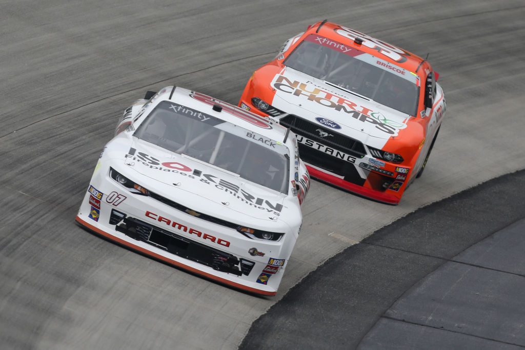 DOVER, DE - MAY 03: Ray Black II, driver of the #07 ISOKERNFireplaces&, and Chase Briscoe, driver of the #98 Nutri Chomps Ford, drive during practice for the NASCAR Xfinity Series Allied Steel Buildings 200 at Dover International Speedway on May 3, 2019 in Dover, Delaware. (Photo by Matt Sullivan/Getty Images) | Getty Images