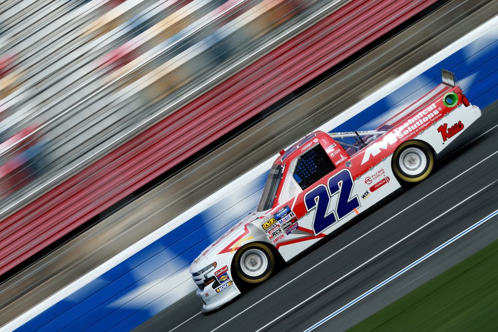 CHARLOTTE, NC - MAY 17: Austin Wayne Self, driver of the #22 GO TEXAN/AM Technical Solutions Chevrolet, practices for the NASCAR Gander Outdoors Truck Series North Carolina Education Lottery 200 at Charlotte Motor Speedway on May 17, 2019 in Charlotte, North Carolina. (Photo by Sean Gardner/Getty Images) | Getty Images