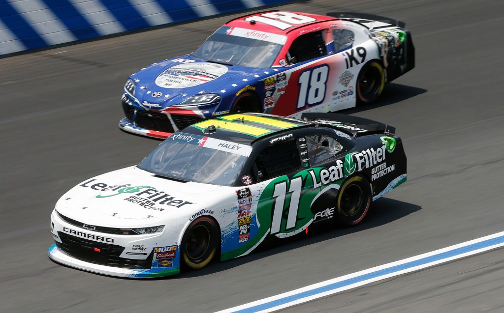 CHARLOTTE, NORTH CAROLINA - MAY 25: Justin Haley, driver of the #11 LeafFilter Gutter Protection Chevrolet, races, Jeffrey Earnhardt, driver of the #18 iK9 Toyota, during the NASCAR Xfinity Series Alsco 300 at Charlotte Motor Speedway on May 25, 2019 in Charlotte, North Carolina. (Photo by Brian Lawdermilk/Getty Images) | Getty Images