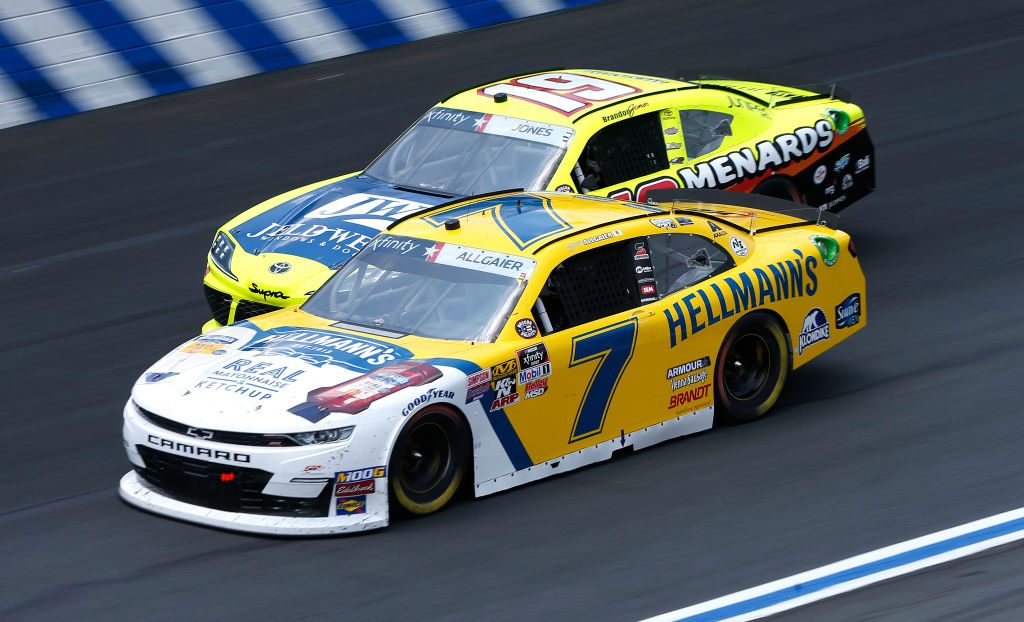 CHARLOTTE, NORTH CAROLINA - MAY 25: Justin Allgaier, driver of the #7 Hellman's Real Mayonaise & Ketchup Chevrolet, races, Brandon Jones, driver of the #19 Menards/Jeld-Wen Toyota, during the NASCAR Xfinity Series Alsco 300 at Charlotte Motor Speedway on May 25, 2019 in Charlotte, North Carolina. (Photo by Brian Lawdermilk/Getty Images) | Getty Images