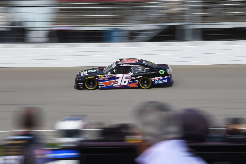 BROOKLYN, MICHIGAN - JUNE 08: Josh Williams, driver of the #36 Starbrite Star Tron/Simcraft Chevrolet, races during qualifying for the NASCAR Xfinity Series LTi Printing 250 at Michigan International Speedway on June 08, 2019 in Brooklyn, Michigan. (Photo by Logan Riely/Getty Images) | Getty Images