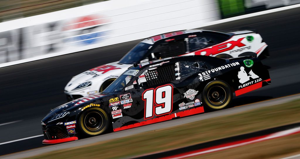 LOUDON, NEW HAMPSHIRE - JULY 20: Brandon Jones, driver of the #19 First Foundation Toyota, leads, Harrison Burton, driver of the #18 Dex Imaging Toyota, during the NASCAR Xfinity Series ROXOR 200 at New Hampshire Motor Speedway on July 20, 2019 in Loudon, New Hampshire. (Photo by Brian Lawdermilk/Getty Images) | Getty Images