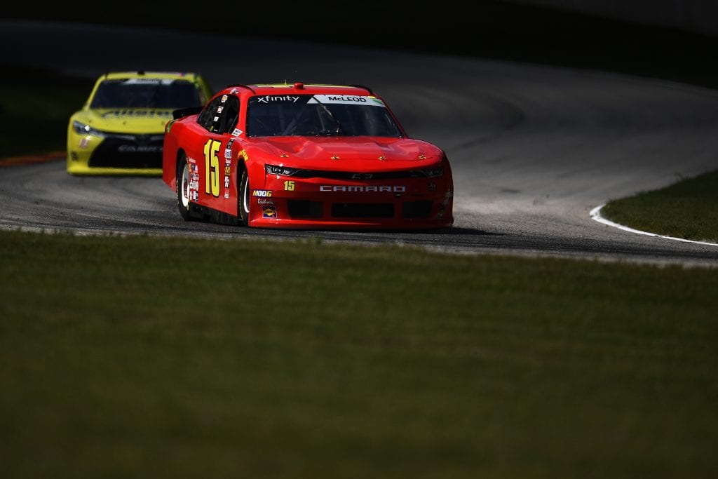 ELKHART LAKE, WISCONSIN - AUGUST 24: BJ McLeod, driver of the JD Motorsports Chevrolet, leads Chad Finchum, driver of the #13 MBM Motorsports Chevrolet, during the NASCAR Xfinity Series CTECH Manufacturing 180 at Road America on August 24, 2019 in Elkhart Lake, Wisconsin. (Photo by Stacy Revere/Getty Images) | Getty Images