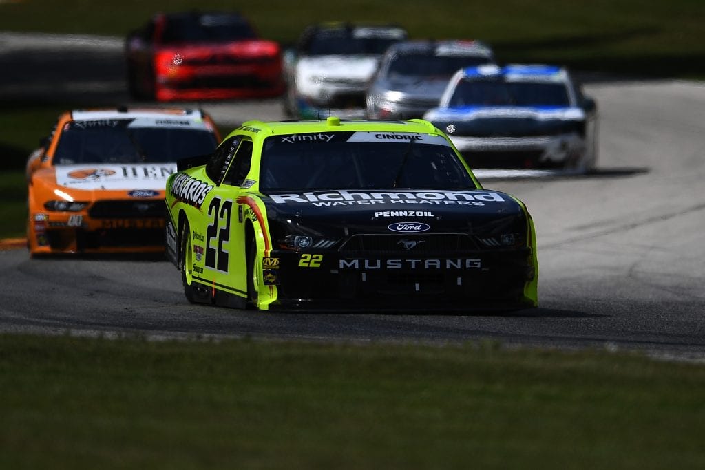 ELKHART LAKE, WISCONSIN - AUGUST 24: Austin Cindric , driver of the #22 Menards/Richmond Ford, leads a pack of cars during the NASCAR Xfinity Series CTECH Manufacturing 180 at Road America on August 24, 2019 in Elkhart Lake, Wisconsin. (Photo by Stacy Revere/Getty Images) | Getty Images