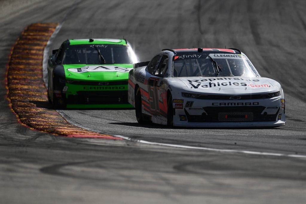 ELKHART LAKE, WISCONSIN - AUGUST 24: Jeremy Clements, driver of the #51 RepairableVehicles.com Chevrolet, leads Regan Smith, driver of the #8 Fire Alarm Services, Inc. Chevrolet, during the NASCAR Xfinity Series CTECH Manufacturing 180 at Road America on August 24, 2019 in Elkhart Lake, Wisconsin. (Photo by Stacy Revere/Getty Images) | Getty Images