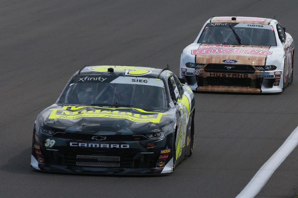 WATKINS GLEN, NEW YORK - AUGUST 03: Ryan Sieg, driver of the #39 Midstate Chevrolet, and Cole Custer, driver of the #00 GoBowling Ford, lead a pack of cars during the NASCAR Xfinity Series Zippo 200 at The Glen at Watkins Glen International on August 03, 2019 in Watkins Glen, New York. (Photo by Sean Gardner/Getty Images) | Getty Images