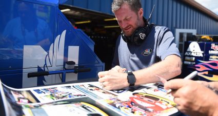 BROOKLYN, MICHIGAN - AUGUST 09: Dale Earnhardt Jr. signs autographs during practice for the Monster Energy NASCAR Cup Series Consumers Energy 400 at Michigan International Speedway on August 09, 2019 in Brooklyn, Michigan. (Photo by Stacy Revere/Getty Images) | Getty Images