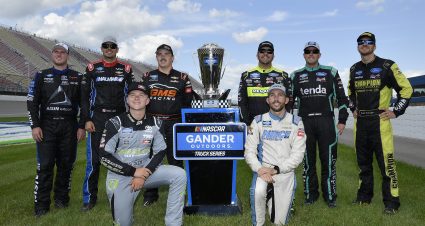 BROOKLYN, MICHIGAN - AUGUST 10: (L-R) Austin Hill, driver of the #16 Hino/AISIN Group Toyota, Stewart Friesen, driver of the #52 Halmar International Chevrolet, Tyler Ankrum, driver of the #17 May's Hawaii Toyota, Brett Moffitt, driver of the #24 Chevrolet Accessories Chevrolet, Matt Crafton, driver of the #88 Chi Chis/Menards Ford, Ross Chastain, driver of the #45 Baja/Niece Equipment Chevrolet, Johnny Sauter, driver of the #13 Tenda Heal Ford, and Grant Enfinger, driver of the #98 ThorSport Racing/Curb Records Ford, pose with the playoff trophy after the NASCAR Gander Outdoor Truck Series Corrigan Oil 200 at Michigan International Speedway on August 10, 2019 in Brooklyn, Michigan. (Photo by Quinn Harris/Getty Images) | Getty Images