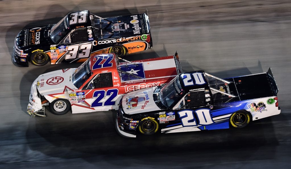 BRISTOL, TENNESSEE - AUGUST 15: Ryan Sieg, driver of the #33 Cook's Comfort System Chevrolet, Austin Wayne Self, driver of the #22 GO TEXAN Chevrolet, and Landon Huffman, driver of the #20 PitStopsForHope.org/Wrench Rags Chevrolet, race during the NASCAR Gander Outdoor Truck Series UNOH 200 presented by Ohio Logistics at Bristol Motor Speedway on August 15, 2019 in Bristol, Tennessee. (Photo by Jared C. Tilton/Getty Images) | Getty Images