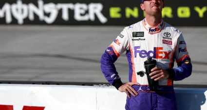 BRISTOL, TENNESSEE - AUGUST 16: Denny Hamlin, driver of the #11 FedEx Freight Toyota, stands on the grid during qualifying for the Monster Energy NASCAR Cup Series Bass Pro Shops NRA Night Race at Bristol Motor Speedway on August 16, 2019 in Bristol, Tennessee. (Photo by Sean Gardner/Getty Images) | Getty Images