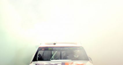 BRISTOL, TENNESSEE - AUGUST 17: Denny Hamlin, driver of the #11 FedEx Freight Toyota, celebrates with a burnout after winning the Monster Energy NASCAR Cup Series Bass Pro Shops NRA Night Race at Bristol Motor Speedway on August 17, 2019 in Bristol, Tennessee. (Photo by Jared C. Tilton/Getty Images) | Getty Images