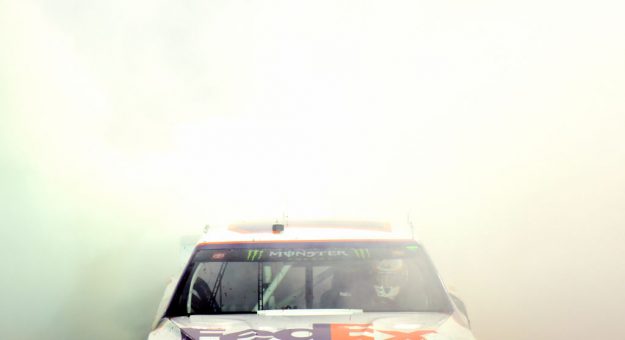 BRISTOL, TENNESSEE - AUGUST 17: Denny Hamlin, driver of the #11 FedEx Freight Toyota, celebrates with a burnout after winning the Monster Energy NASCAR Cup Series Bass Pro Shops NRA Night Race at Bristol Motor Speedway on August 17, 2019 in Bristol, Tennessee. (Photo by Jared C. Tilton/Getty Images) | Getty Images