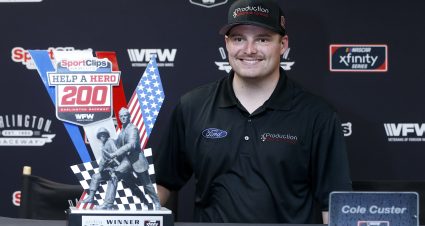 DARLINGTON, SOUTH CAROLINA - AUGUST 31: Cole Custer, driver of the #00 Production Alliance Group Ford, poses with the trophy after winning the NASCAR Xfinity Series Sport Clips Haircuts VFW 200 at Darlington Raceway on August 31, 2019 in Darlington, South Carolina. The #18 Sport Clips Toyota, driven by Denny Hamlin (not pictured), was deemed illegal after post race inspection and was stripped of the victory. (Photo by Brian Lawdermilk/Getty Images) | Getty Images