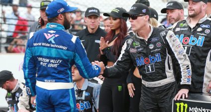 INDIANAPOLIS, INDIANA - SEPTEMBER 08: Kevin Harvick, driver of the #4 Mobil 1 Ford, shakes hands with Bubba Wallace, driver of the #43 World Wide Technology Chevrolet, after winning the Monster Energy NASCAR Cup Series Big Machine Vodka 400 at the Brickyard at Indianapolis Motor Speedway on September 08, 2019 in Indianapolis, Indiana. (Photo by Matt Sullivan/Getty Images) | Getty Images