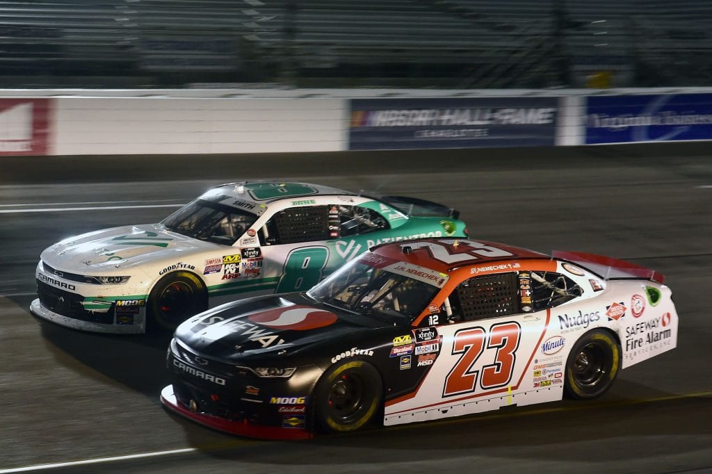 RICHMOND, VIRGINIA - SEPTEMBER 20: John Hunter Nemechek, driver of the #23 Safeway Chevrolet, races Zane Smith, driver of the #8 PatientPop Chevrolet, during the NASCAR Xfinity Series GoBowling 250 at Richmond Raceway on September 20, 2019 in Richmond, Virginia. (Photo by Jared C. Tilton/Getty Images) | Getty Images