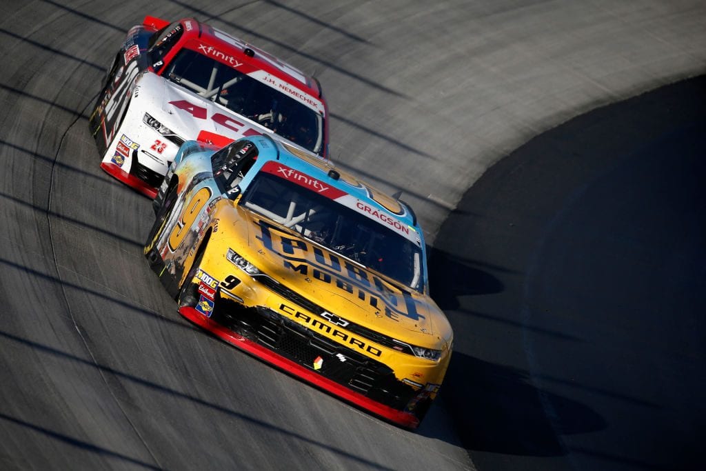 DOVER, DELAWARE - OCTOBER 05: Noah Gragson, driver of the #9 PUBG MOBILE Chevrolet, leads John Hunter Nemechek, driver of the #23 ACME Chevrolet, during the NASCAR Xfinity Series Use Your Melon Drive Sober 200 at Dover International Speedway on October 05, 2019 in Dover, Delaware. (Photo by Jeff Zelevansky/Getty Images)
