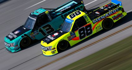 TALLADEGA, ALABAMA - OCTOBER 11: Matt Crafton, driver of the #88 Black Label Bacon/Menards Ford, and Johnny Sauter, driver of the #13 Tenda Heal Ford, practice for the NASCAR Gander Outdoor Truck Series Sugarlands Shine 250 at Talladega Superspeedway on October 11, 2019 in Talladega, Alabama. (Photo by Sean Gardner/Getty Images) | Getty Images