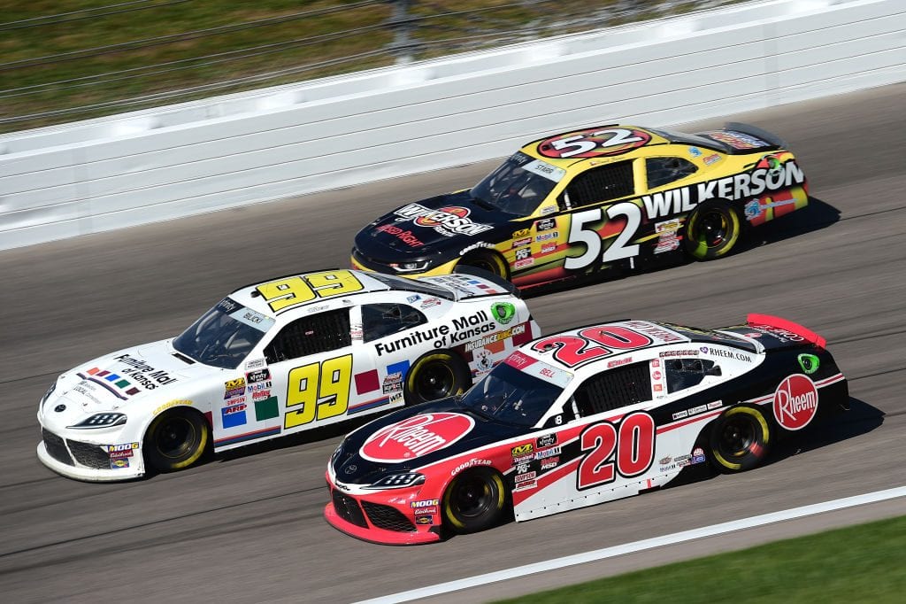 KANSAS CITY, KANSAS - OCTOBER 19: Christopher Bell, driver of the #20 Rheem Toyota, races Josh Bilicki, driver of the #99 Furniture Mall of Kansas Toyota, and David Starr, driver of the #52 Wilkerson Rental Chevrolet, during the NASCAR Xfinity Series Kansas Lottery 300 at Kansas Speedway on October 19, 2019 in Kansas City, Kansas. (Photo by Jared C. Tilton/Getty Images) | Getty Images