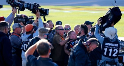 KANSAS CITY, KANSAS - OCTOBER 19: Tyler Reddick, driver of the #2 TAME the BEAST Chevrolet, is restrained on pit lane after fighting with Cole Custer, driver of the #00 Production Alliance Group Ford, after the NASCAR Xfinity Series Kansas Lottery 300 at Kansas Speedway on October 19, 2019 in Kansas City, Kansas. (Photo by Jonathan Ferrey/Getty Images) | Getty Images
