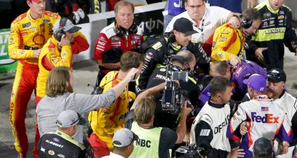 MARTINSVILLE, VIRGINIA - OCTOBER 27: Denny Hamlin, driver of the #11 FedEx Freight Toyota, Joey Logano, driver of the #22 Shell Pennzoil Ford, and their crews have an altercation on pit lane following the Monster Energy NASCAR Cup Series First Data 500 at Martinsville Speedway on October 27, 2019 in Martinsville, Virginia. (Photo by Brian Lawdermilk/Getty Images) | Getty Images