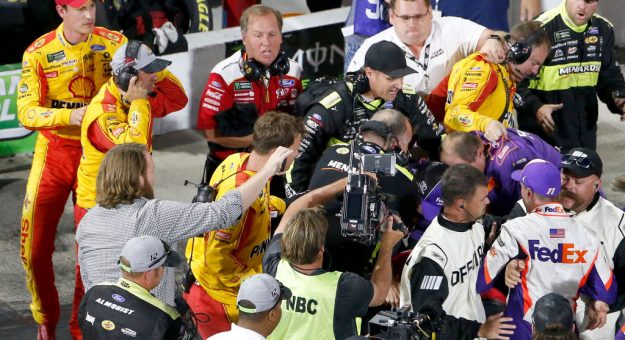 MARTINSVILLE, VIRGINIA - OCTOBER 27: Denny Hamlin, driver of the #11 FedEx Freight Toyota, Joey Logano, driver of the #22 Shell Pennzoil Ford, and their crews have an altercation on pit lane following the Monster Energy NASCAR Cup Series First Data 500 at Martinsville Speedway on October 27, 2019 in Martinsville, Virginia. (Photo by Brian Lawdermilk/Getty Images) | Getty Images