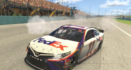 HOMESTEAD, FLORIDA - MARCH 22: (EDITORIAL USE ONLY) (Editors note: This image was computer generated in-game) Denny Hamlin, driver of the #11 FedEx Toyota, celebrates after winning the eNASCAR iRacing Pro Invitational Series Dixie Vodka 150 at virtual Homestead-Miami Speedway on March 22, 2020 in Homestead, Florida. (Photo by Chris Graythen/Getty Images) | Getty Images
