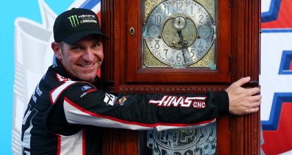 MARTINSVILLE, VA - MARCH 26:  Clint Bowyer, driver of the #14 Haas Automation Demo Day Ford, celebrates with the trophy in Victory Lane after winning the weather delayed Monster Energy NASCAR Cup Series STP 500 at Martinsville Speedway on March 26, 2018 in Martinsville, Virginia.  (Photo by Sarah Crabill/Getty Images) | Getty Images
