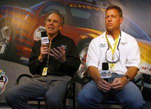 DAYTONA BEACH, FL - FEBRUARY 19: Former Dallas Cowboy quarterbacks Roger Staubach (L) and Troy Aikman answer questions during a press conference before the NASCAR Nextel Cup Series Daytona 500 on February 19, 2006 at Daytona International Speedway in Daytona Beach, Florida. (Photo by Rusty Jarrett/Getty Images) | Getty Images