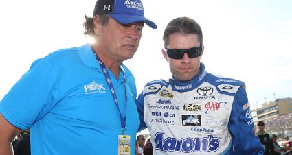 HOMESTEAD, FL - NOVEMBER 22:  David Ragan, driver of the #55 Aaron's Online Dream Machine Toyota, talks to team owner Michael Waltrip during pre-race ceremonies for the NASCAR Sprint Cup Series Ford EcoBoost 400 at Homestead-Miami Speedway on November 22, 2015 in Homestead, Florida.  (Photo by Chris Graythen/Getty Images) | Getty Images