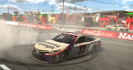 NORTH WILKESBORO, NORTH CAROLINA - MAY 09: (EDITORIAL USE ONLY) (Editors note: This image was computer generated in-game) Denny Hamlin, driver of the #11 FedEx Delivering Strength Toyota, celebrates after winning the eNASCAR iRacing Pro Invitational Series North Wilkesboro 160 at virtual North Wilkesboro Speedway on May 09, 2020 in North Wilkesboro, North Carolina. (Photo by Chris Graythen/Getty Images) | Getty Images