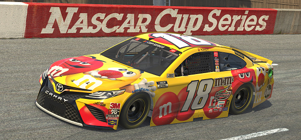 NORTH WILKESBORO, NORTH CAROLINA - MAY 09: (EDITORIAL USE ONLY) (Editors note: This image was computer generated in-game) Kyle Busch, driver of the #18 M&M's / Red Nose Day Toyota, races during the eNASCAR iRacing Pro Invitational Series North Wilkesboro 160 at virtual North Wilkesboro Speedway on May 09, 2020 in North Wilkesboro, North Carolina. (Photo by Chris Graythen/Getty Images) | Getty Images