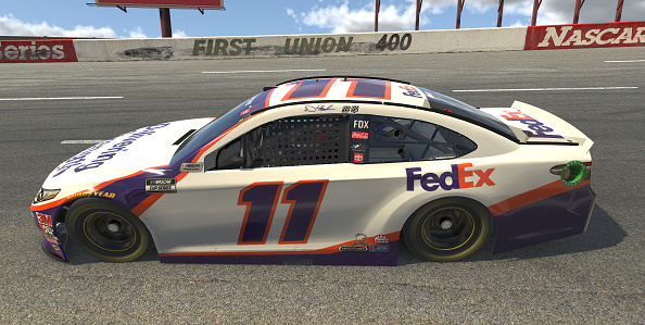 NORTH WILKESBORO, NORTH CAROLINA - MAY 09: (EDITORIAL USE ONLY) (Editors note: This image was computer generated in-game) Denny Hamlin, driver of the #11 FedEx Delivering Strength Toyota, races during the eNASCAR iRacing Pro Invitational Series North Wilkesboro 160 at virtual North Wilkesboro Speedway on May 09, 2020 in North Wilkesboro, North Carolina. (Photo by Chris Graythen/Getty Images) | Getty Images