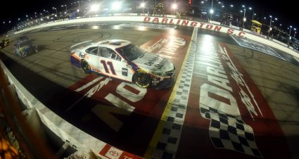 DARLINGTON, SOUTH CAROLINA - MAY 20: Denny Hamlin, driver of the #11 FedEx Delivering Strength Toyota, crosses the finish line under caution to later win the rain-delayed NASCAR Cup Series Toyota 500 at Darlington Raceway on May 20, 2020 in Darlington, South Carolina. (Photo by Jared C. Tilton/Getty Images) | Getty Images