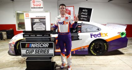 DARLINGTON, SOUTH CAROLINA - MAY 20: Denny Hamlin, driver of the #11 FedEx Delivering Strength Toyota, celebrates in Victory Lane after winning the rain-shortened NASCAR Cup Series Toyota 500 at Darlington Raceway on May 20, 2020 in Darlington, South Carolina. (Photo by Chris Graythen/Getty Images) | Getty Images