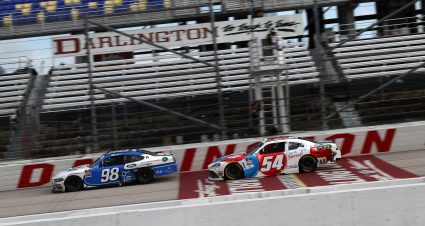 DARLINGTON, SOUTH CAROLINA - MAY 21: Chase Briscoe, driver of the #98 HighPoint.com Ford, crosses the finish line in front of Kyle Busch, driver of the #54 Thank You Heroes/M&M's Toyota, winning the NASCAR Xfinity Series Toyota 200 at Darlington Raceway on May 21, 2020 in Darlington, South Carolina. (Photo by Chris Graythen/Getty Images) | Getty Images