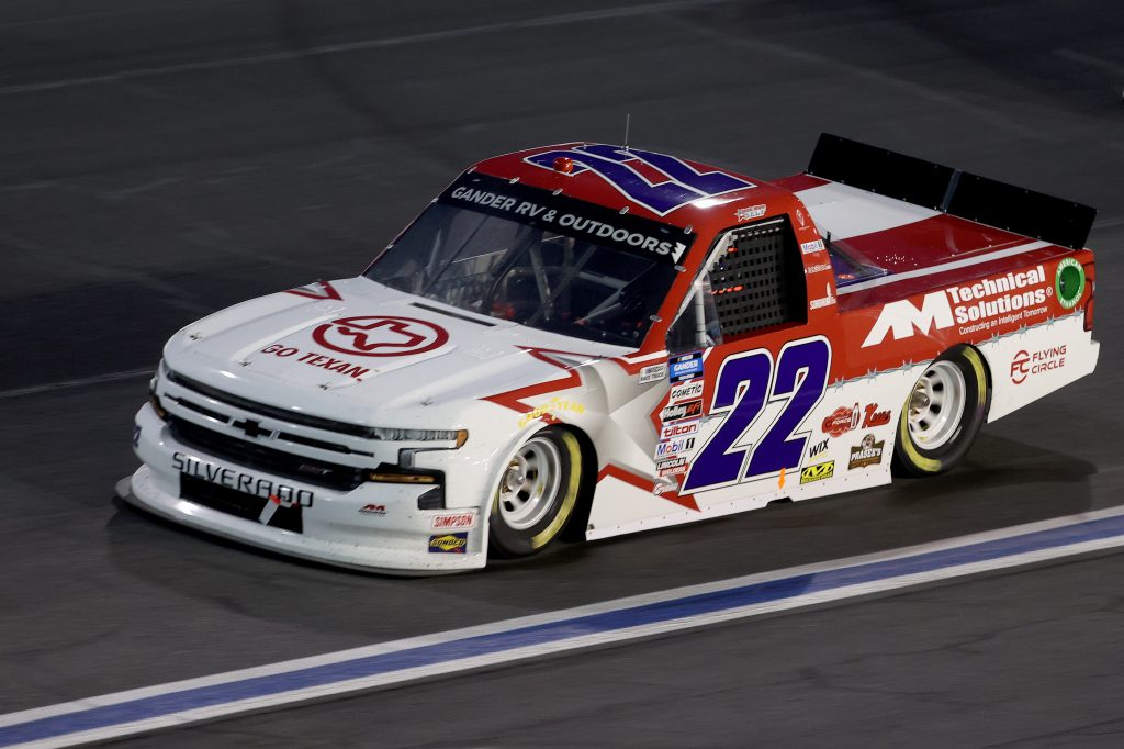 CONCORD, NORTH CAROLINA - MAY 26: Austin Wayne Self, driver of the #22 GO TEXAN/AM Technical Solutions Chevrolet, drives during the NASCAR Gander Outdoors Trucks Series North Carolina Education Lottery 200 at Charlotte Motor Speedway on May 26, 2020 in Concord, North Carolina. (Photo by Chris Graythen/Getty Images) | Getty Images