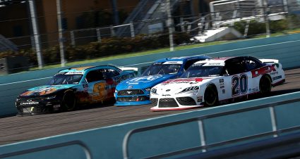 HOMESTEAD, FLORIDA - JUNE 13: Harrison Burton, driver of the #20 DEX Imaging Toyota, races Austin Cindric, driver of the #22 PPG Ford, and Noah Gragson, driver of the #9 PUBG MOBILE Chevrolet, during the NASCAR Xfinity Series Hooters 250 at Homestead-Miami Speedway on June 13, 2020 in Homestead, Florida. (Photo by Chris Graythen/Getty Images) | Getty Images