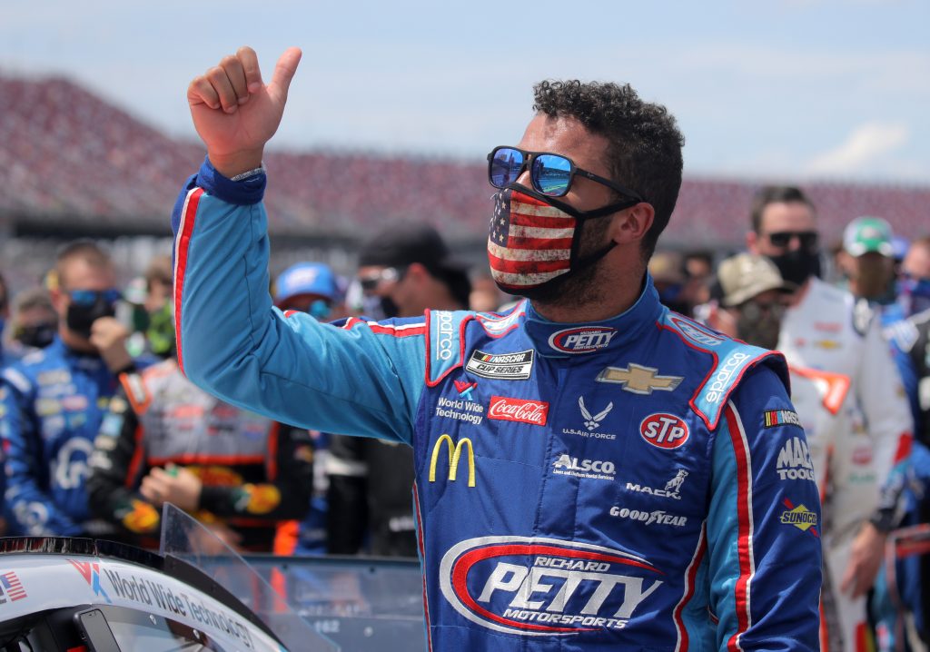 TALLADEGA, ALABAMA - JUNE 22: Bubba Wallace, driver of the #43 Victory Junction Chevrolet, gives a thumbs up prior to the NASCAR Cup Series GEICO 500 at Talladega Superspeedway on June 22, 2020 in Talladega, Alabama. A noose was found in the garage stall of NASCAR driver Bubba Wallace at Talladega Superspeedway a week after the organization banned the Confederate flag at its facilities. (Photo by Chris Graythen/Getty Images) | Getty Images