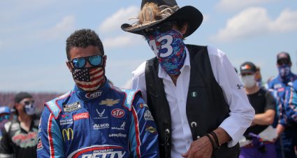 TALLADEGA, ALABAMA - JUNE 22:  Team owner and NASCAR Hall of Famer Richard Petty stands with Bubba Wallace, driver of the #43 Victory Junction Chevrolet, during pre-race ceremonies prior to the NASCAR Cup Series GEICO 500 at Talladega Superspeedway on June 22, 2020 in Talladega, Alabama. A noose was found in the garage stall of NASCAR driver Bubba Wallace at Talladega Superspeedway a week after the organization banned the Confederate flag at its facilities. (Photo by Chris Graythen/Getty Images) | Getty Images