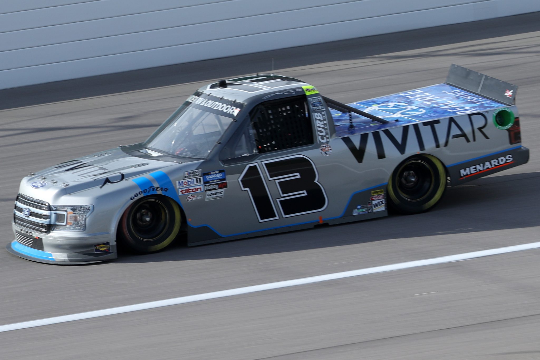 KANSAS CITY, KANSAS - OCTOBER 17: Johnny Sauter, driver of the #13 Vivitar Ford, drives during the NASCAR Gander RV & Outdoors Truck Series Clean Harbors 200at Kansas Speedway on October 17, 2020 in Kansas City, Kansas. (Photo by Chris Graythen/Getty Images) | Getty Images