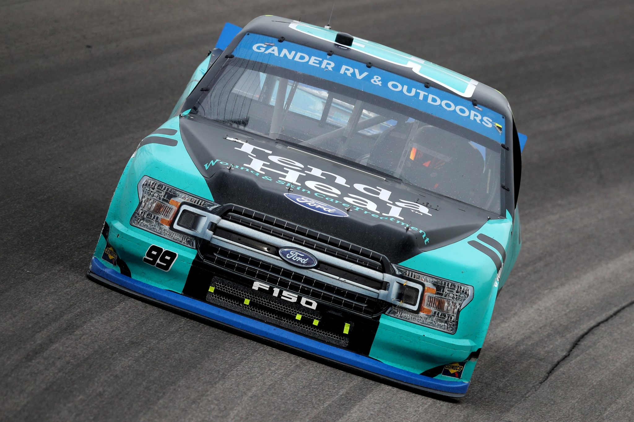 KANSAS CITY, KANSAS - OCTOBER 17: Ben Rhodes, driver of the #99 Tenda Heal Ford, drives during the NASCAR Gander RV & Outdoors Truck Series Clean Harbors 200at Kansas Speedway on October 17, 2020 in Kansas City, Kansas. (Photo by Jamie Squire/Getty Images) | Getty Images
