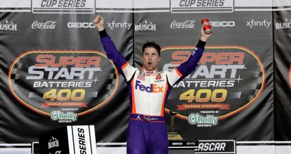 KANSAS CITY, KANSAS - JULY 23: Denny Hamlin, driver of the #11 FedEx Office Toyota, celebrates in Victory Lane after winning the NASCAR Cup Series Super Start Batteries 400 Presented by O'Reilly Auto Parts at Kansas Speedway on July 23, 2020 in Kansas City, Kansas. (Photo by Jamie Squire/Getty Images) | Getty Images
