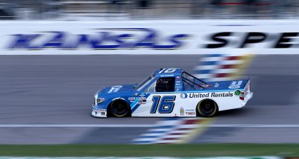 KANSAS CITY, KANSAS - JULY 24: Austin Hill, driver of the #16 United Rentals Toyota, crosses the finish line to win the NASCAR Gander RV & Outdoors Truck Series Kansas 200 at Kansas Speedway on July 24, 2020 in Kansas City, Kansas. (Photo by Jamie Squire/Getty Images) | Getty Images