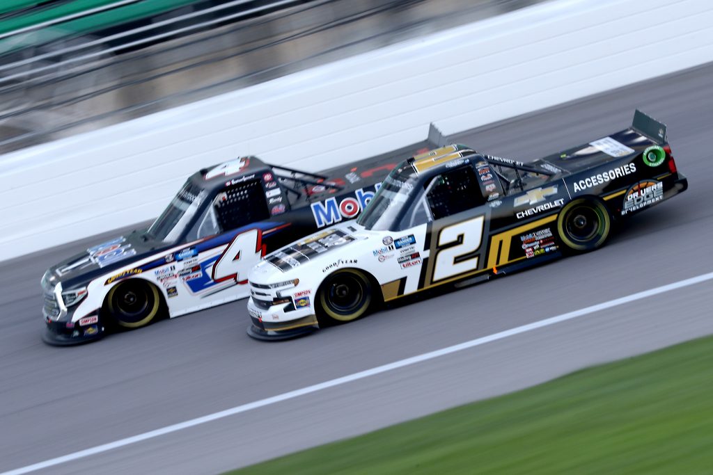 KANSAS CITY, KANSAS - JULY 24: Sheldon Creed, driver of the #2 Chevy Accessories Chevrolet, races Raphael Lessard, driver of the #4 Mobil 1 Toyota, during the NASCAR Gander RV & Outdoors Truck Series Kansas 200 at Kansas Speedway on July 24, 2020 in Kansas City, Kansas. (Photo by Jamie Squire/Getty Images) | Getty Images