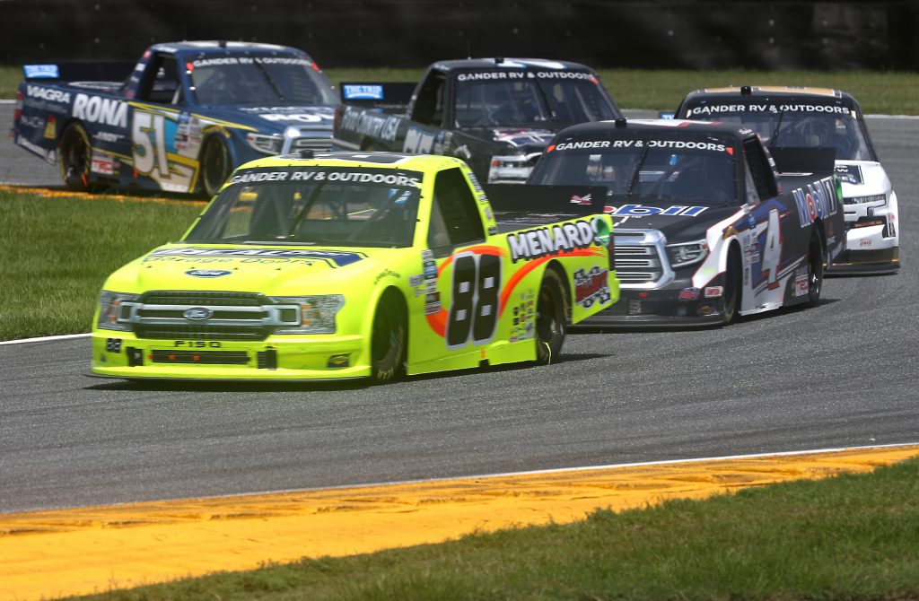DAYTONA BEACH, FLORIDA - AUGUST 16: Matt Crafton, driver of the #88 Ideal Door/Menards Ford, races Raphael Lessard, driver of the #4 Mobil 1 Toyota, during the NASCAR Gander RV & Outdoors Truck Series Sunoco 159 at Daytona International Speedway on August 16, 2020 in Daytona Beach, Florida. (Photo by Chris Graythen/Getty Images) | Getty Images