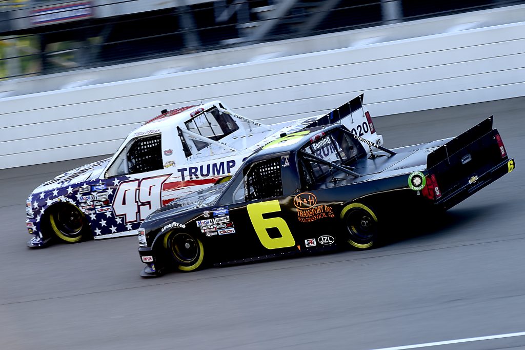 BROOKLYN, MICHIGAN - AUGUST 07: Tim Viens, driver of the #49 CMI Motorsports Chevrolet, races Norm Benning, driver of the #6 H&H Transport Chevrolet, during the NASCAR Gander RV & Outdoors Truck Series Henry Ford Health System 200 at Michigan International Speedway on August 07, 2020 in Brooklyn, Michigan. (Photo by Jared C. Tilton/Getty Images) | Getty Images