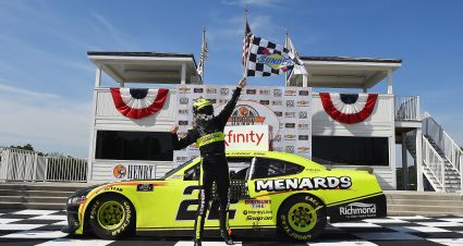 ELKHART LAKE, WISCONSIN - AUGUST 08:  Austin Cindric, driver of the #22 Menards/Richmond Ford, celebrates in Victory Lane after winning the NASCAR Xfinity Series Henry 180 at Road America on August 08, 2020 in Elkhart Lake, Wisconsin. (Photo by Stacy Revere/Getty Images) | Getty Images